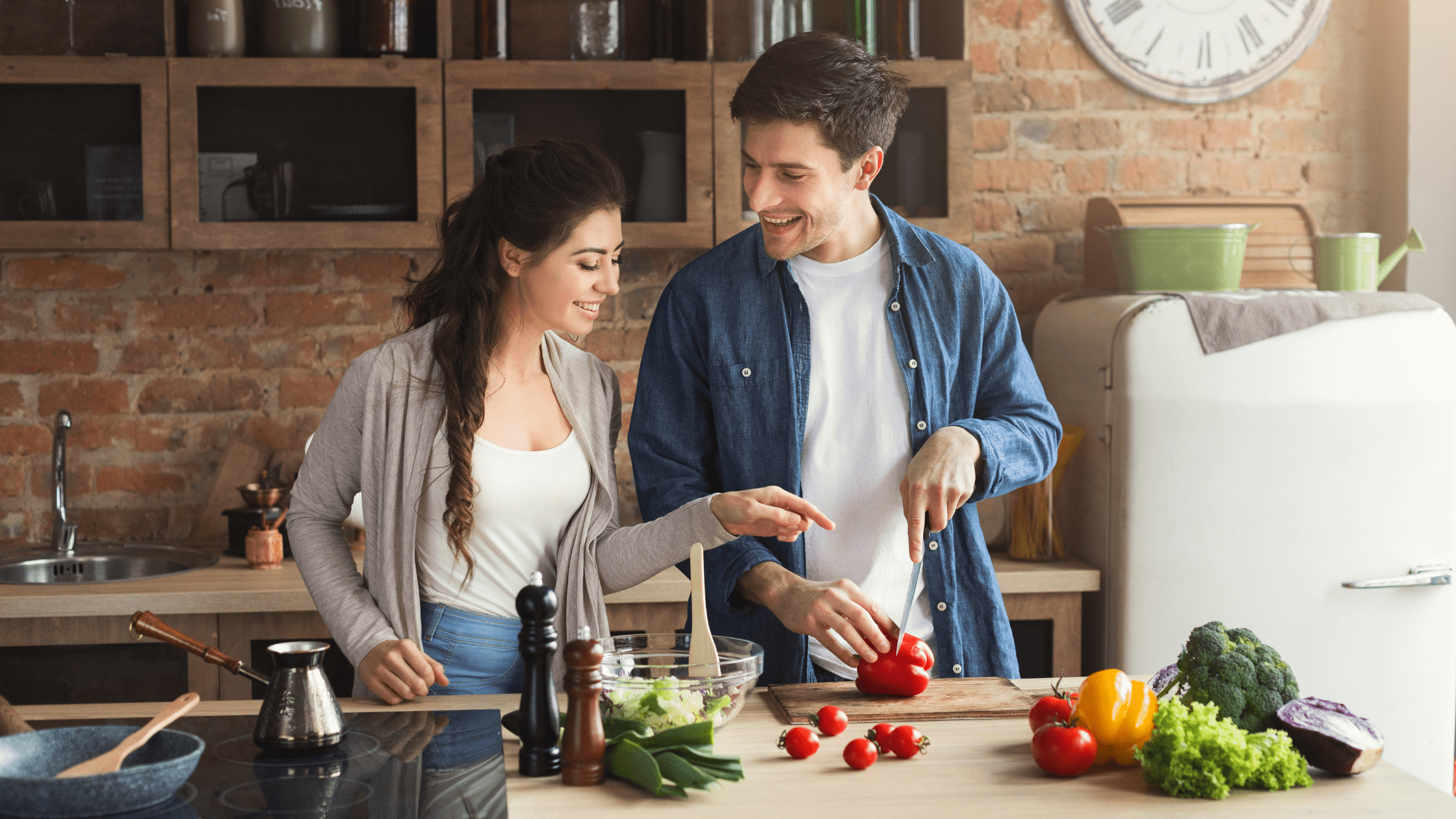 Couple cooking health food in their kitchen