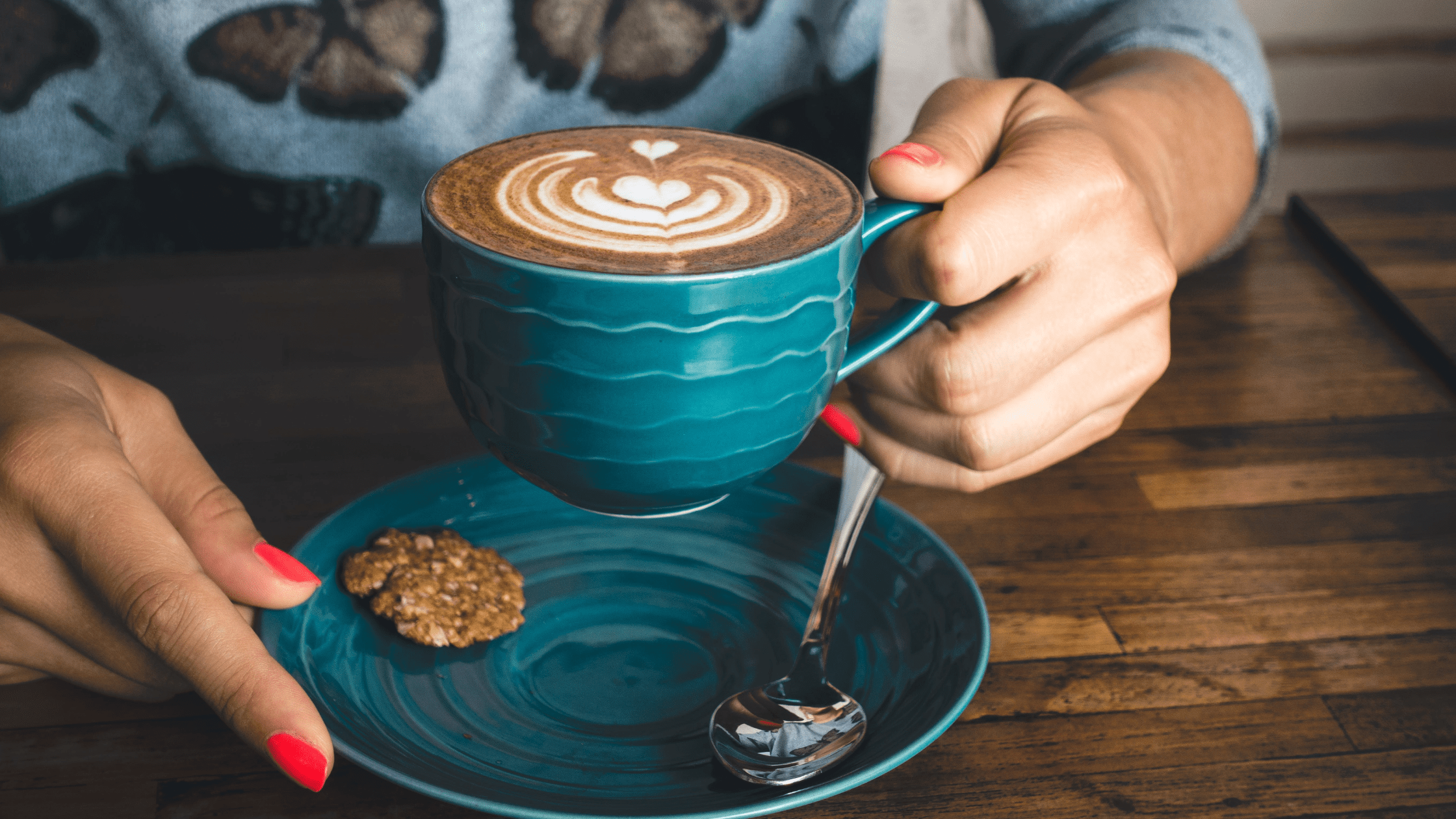 Person holding a coffee