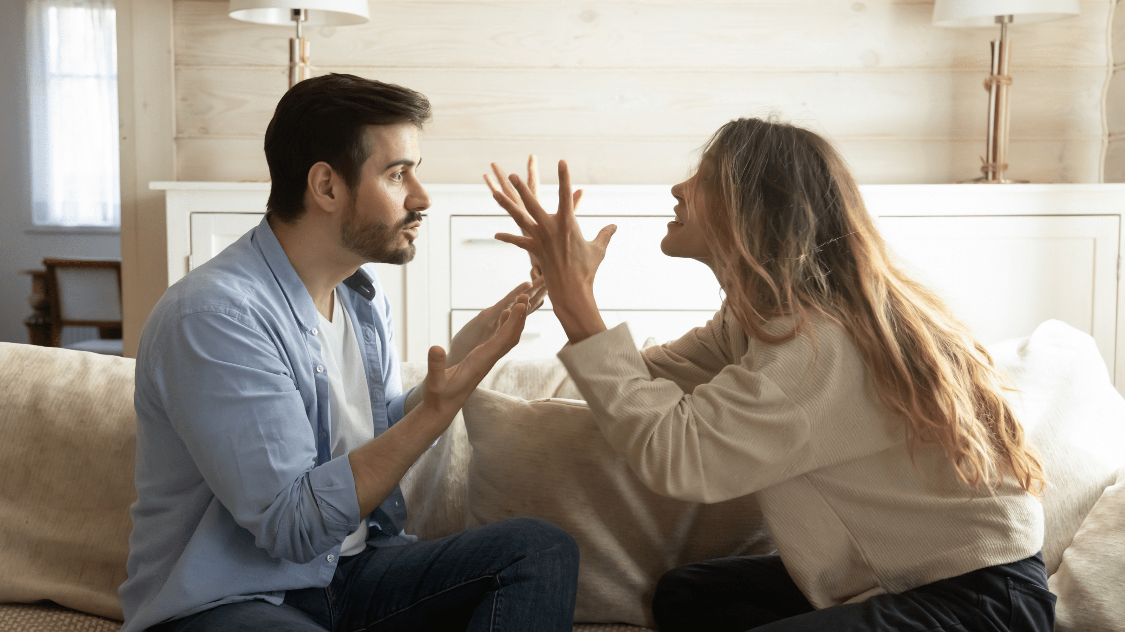 Couple arguing in their lounge