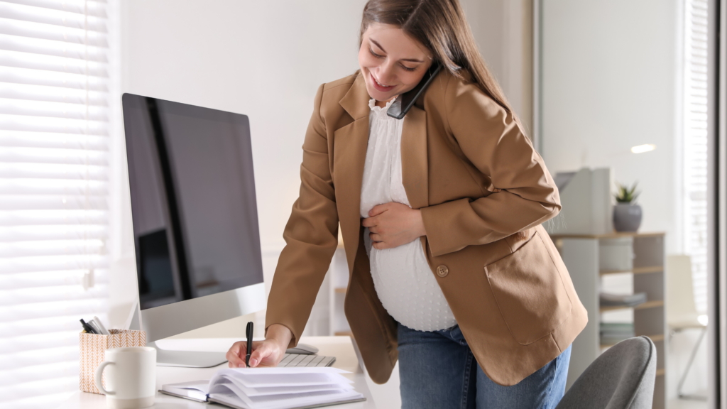 Pregnant woman getting ready to leave work