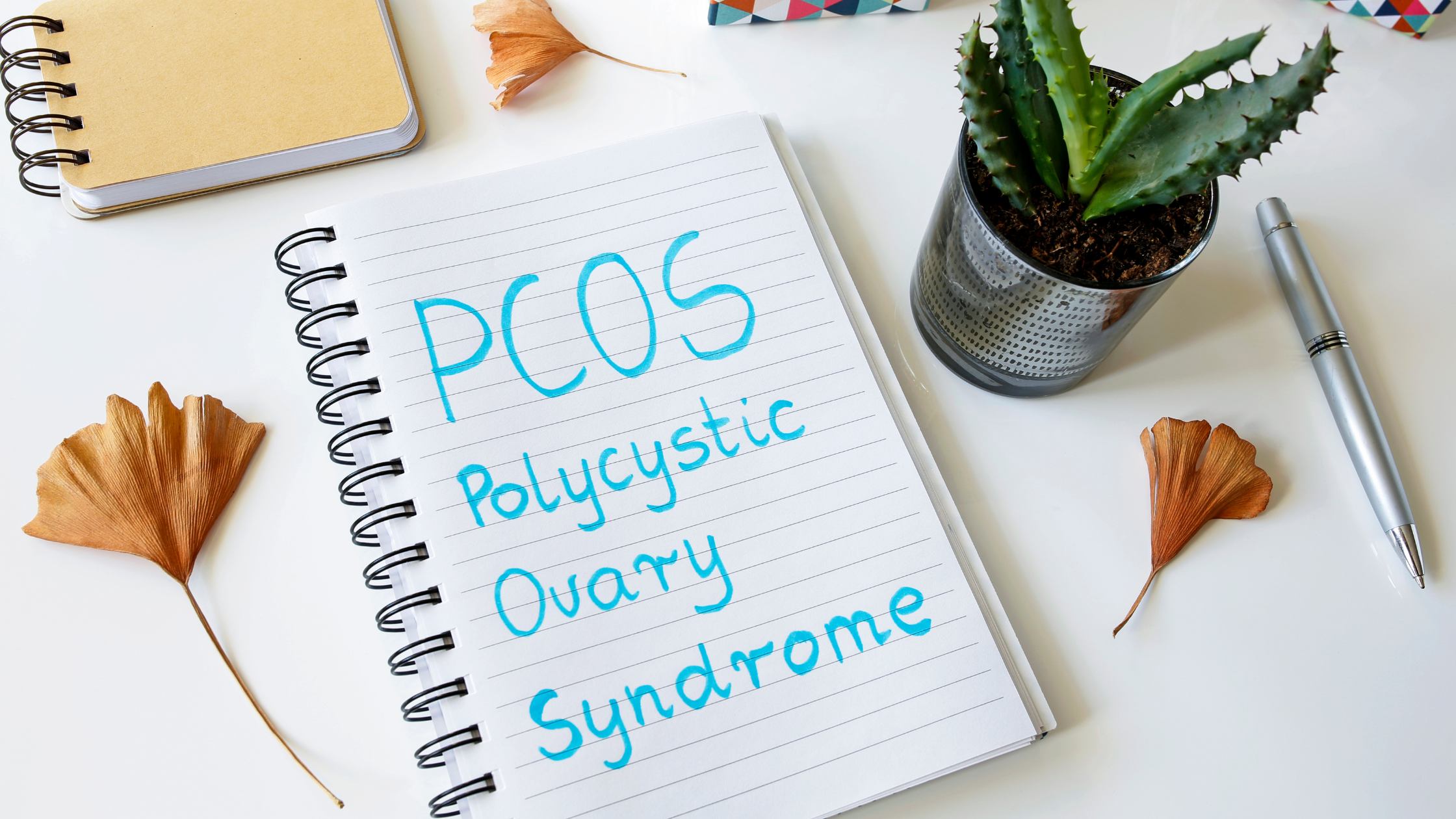 PCOS written on a pad of paper