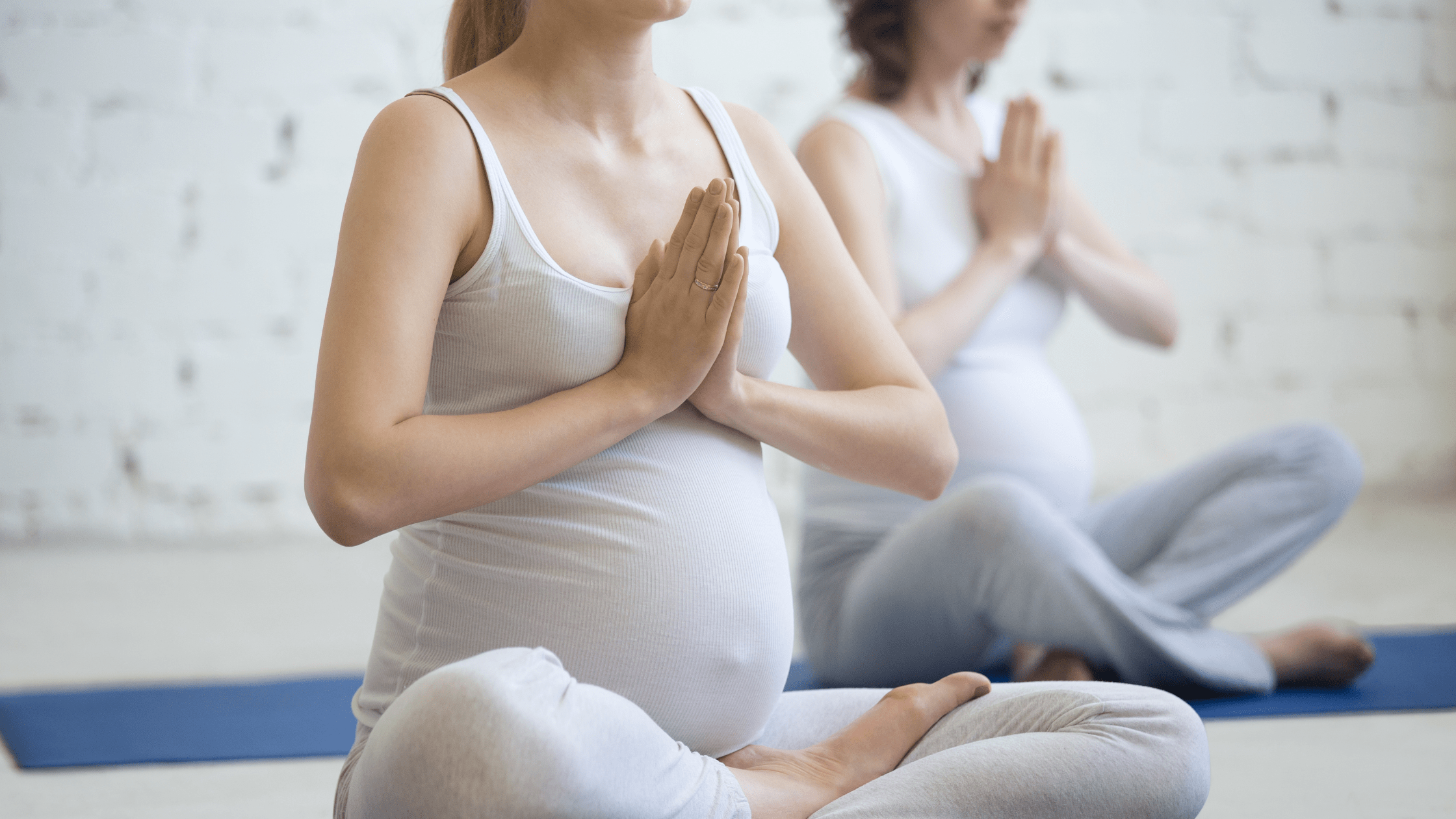 Pregnant women doing yoga