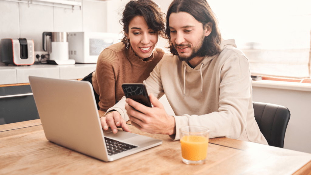 Young couple prepare pregnant plan checkup preconception consult at home sofa. Clinic app illness screen on online advice doctor remote exam telemedicine video call talk on tablet phone.
