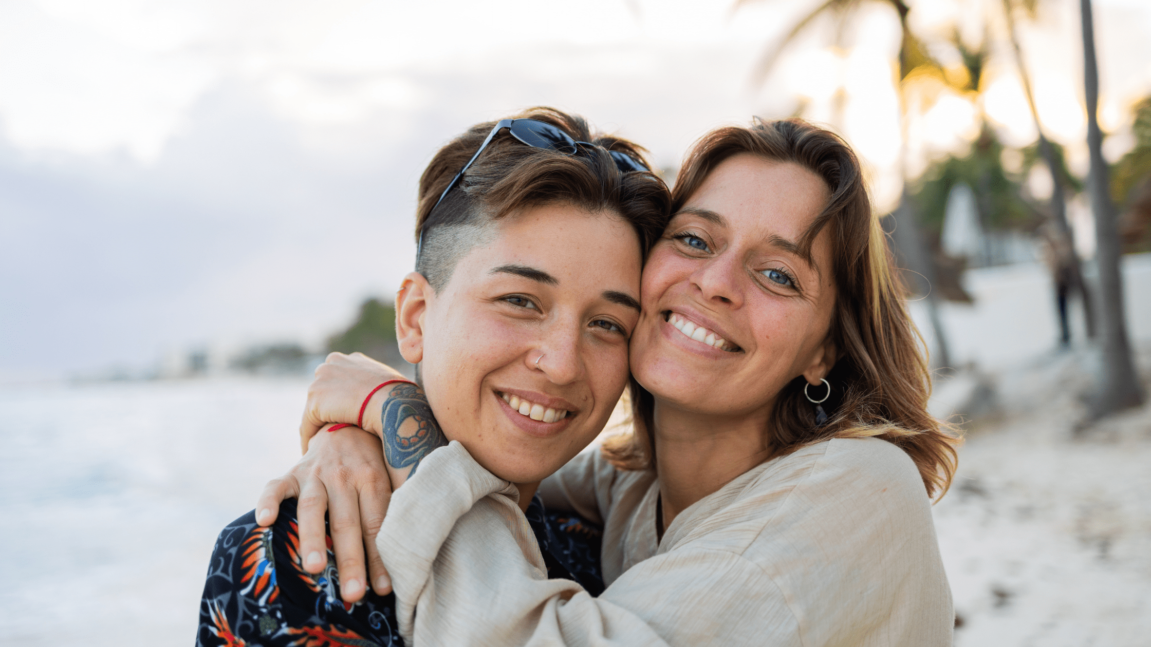 Same sex couple smiling at camera