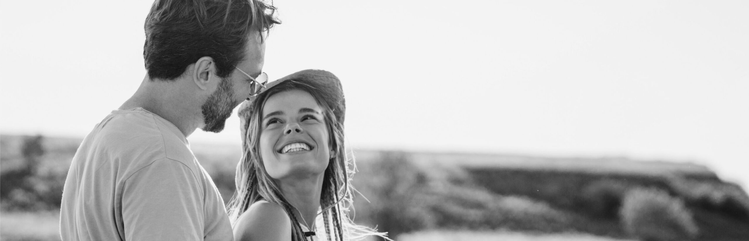 A couple looking loving at each other on the beach 