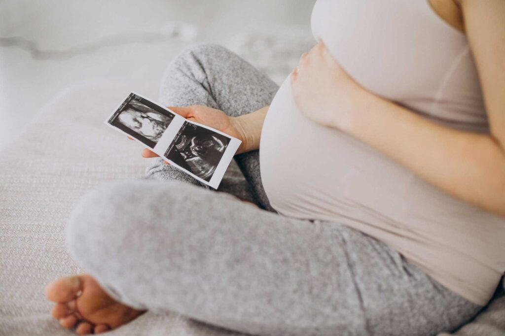 Pregnant lady looking at scan images