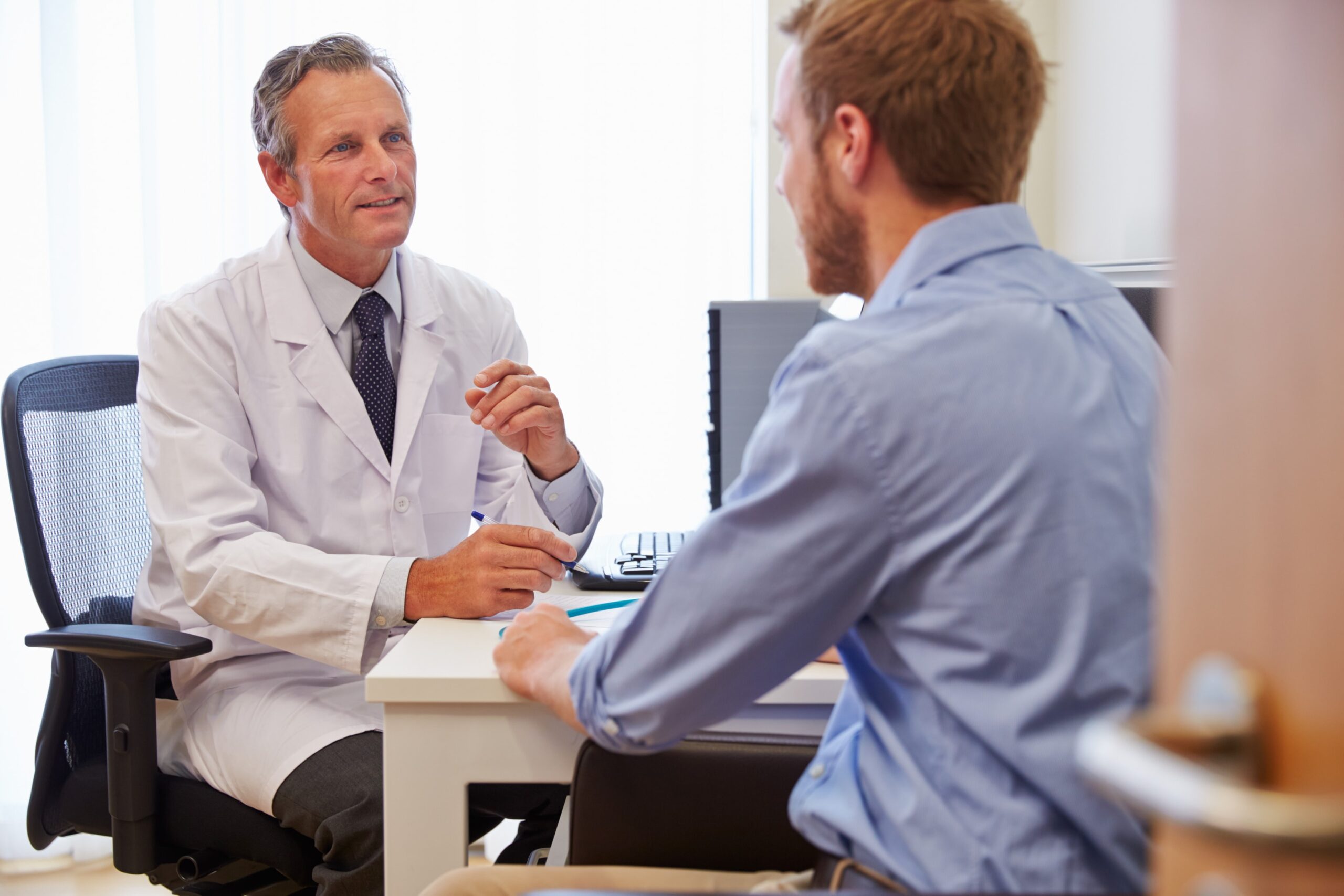 Doctor discussing male infertility and azoospermia treatment options