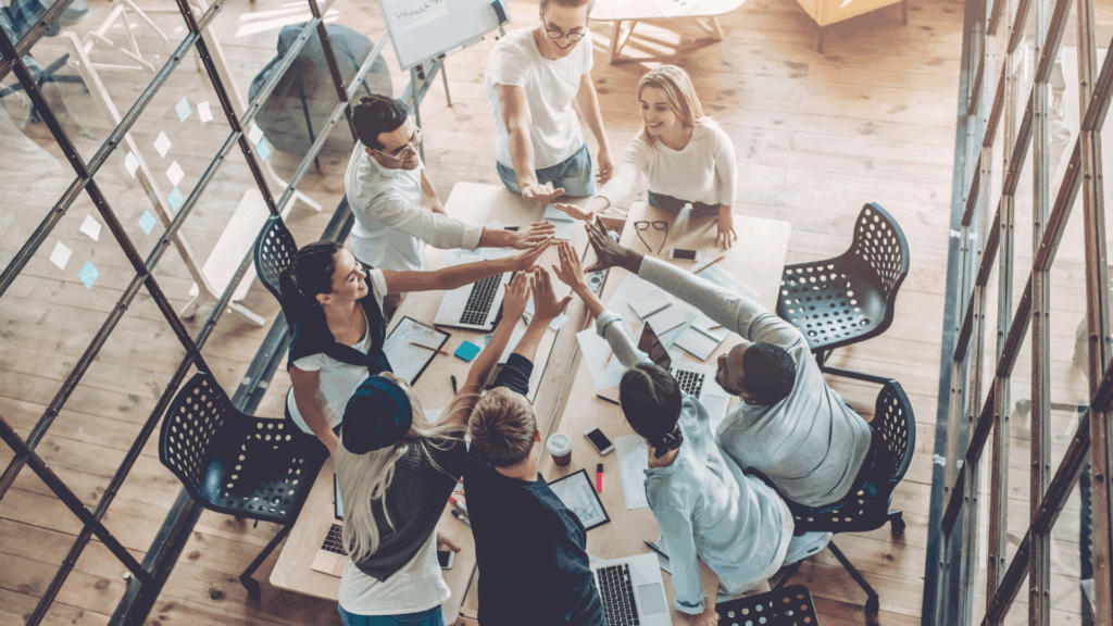 team high fiving each other